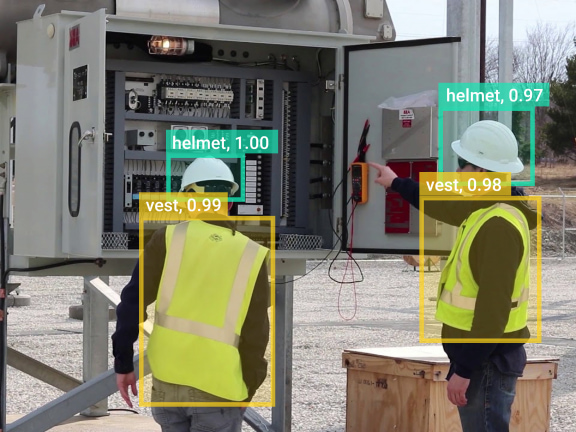 Timelapselab AI computer vision system detecting helmets and safety vests on workers.